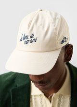 Load image into Gallery viewer, Le Livre De Mon Ami Soft Trucker Cap - Ecru